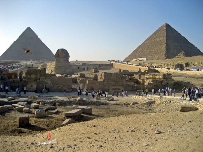 Picture of pyramids, sphinx, and litter in Giza, Egypt